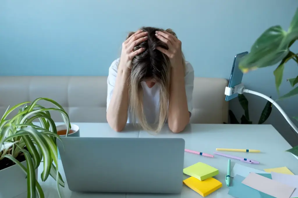 Woman freelancer in stress. No ideas. Emotional burnout at work
