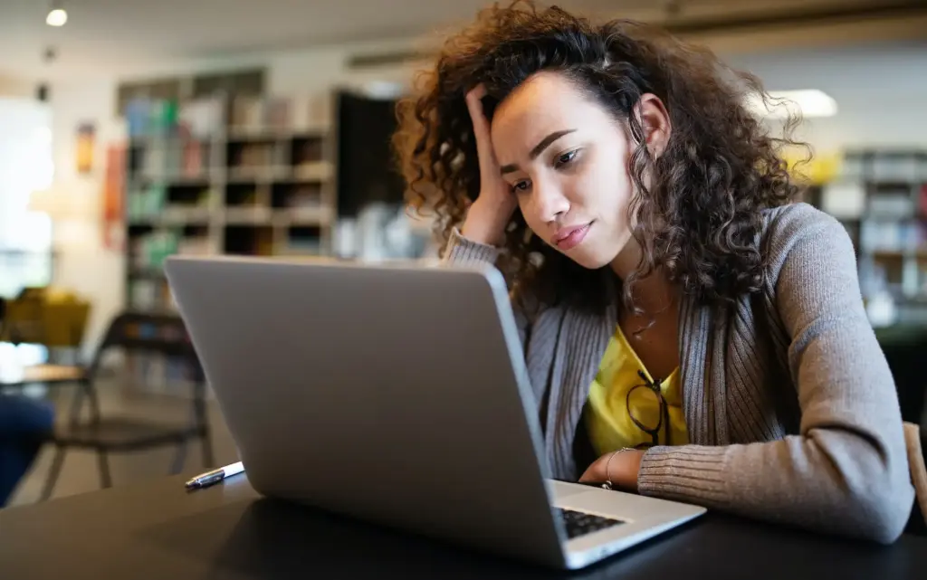 Woman with ADHD having a hard time concentrating.